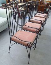 A set of four wrought iron framed terrace chairs