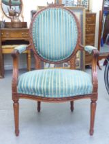 A modern Louis XVI design stained beech framed salon chair with grey fabric upholstery, raised on