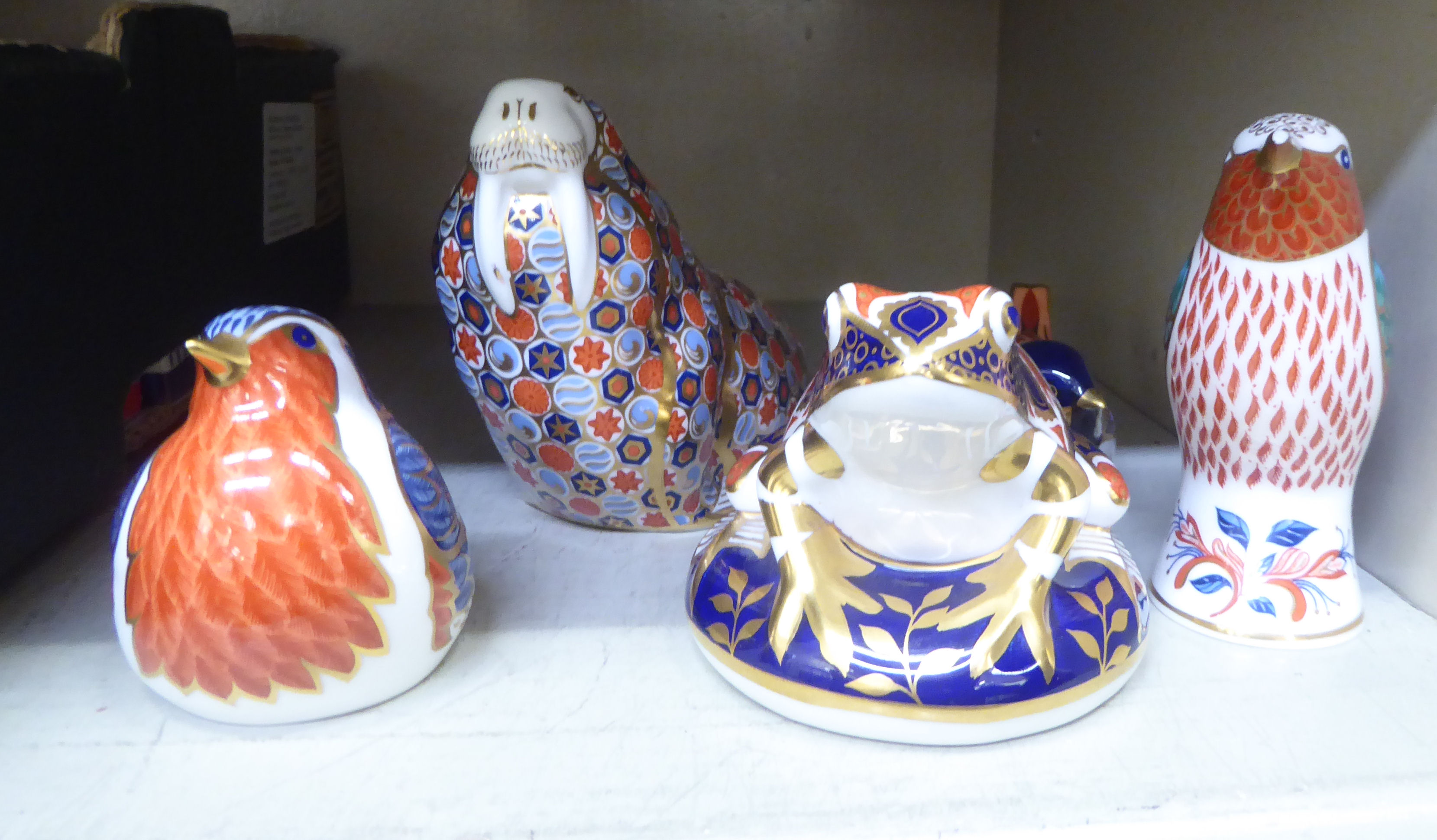 Five Royal Crown Derby china paperweights: to include a frog  4"L; three with gilt; two with