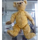 A 1930s Chiltern Teddy bear with a golden mohair jointed body  18"h