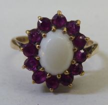 A 9ct gold cluster ring, set with red and white stones