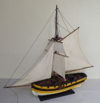 A modern painted wooden replica of a Hunter 1797 galleon, on a plinth  32"L overall