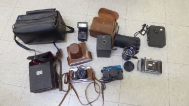 Photographic equipment: to include flashes; and a Zenit 'E' camera