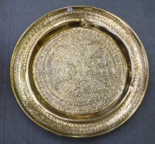 A 20thC pressed brass charger  36"dia