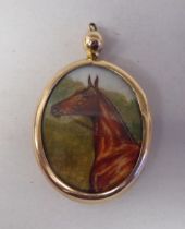 An antique 9ct gold framed, double sided, oval locket
