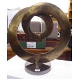 A modern bi-coloured textured metal sculpture of coiled form, on a plinth  22"h