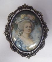 An antique silver and marcasite, oval brooch, set with a Gainsborough style portrait miniature
