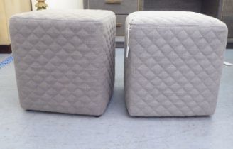 A pair of modern grey upholstered and quilted, stone coloured fabric cube stools
