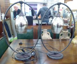 A pair of modern wrought metal hoop design table lamps with drop glass shades  26"h