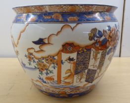 A Chinese style ceramic fish bowl, having an inverted rim, decorated in colours and gilding with