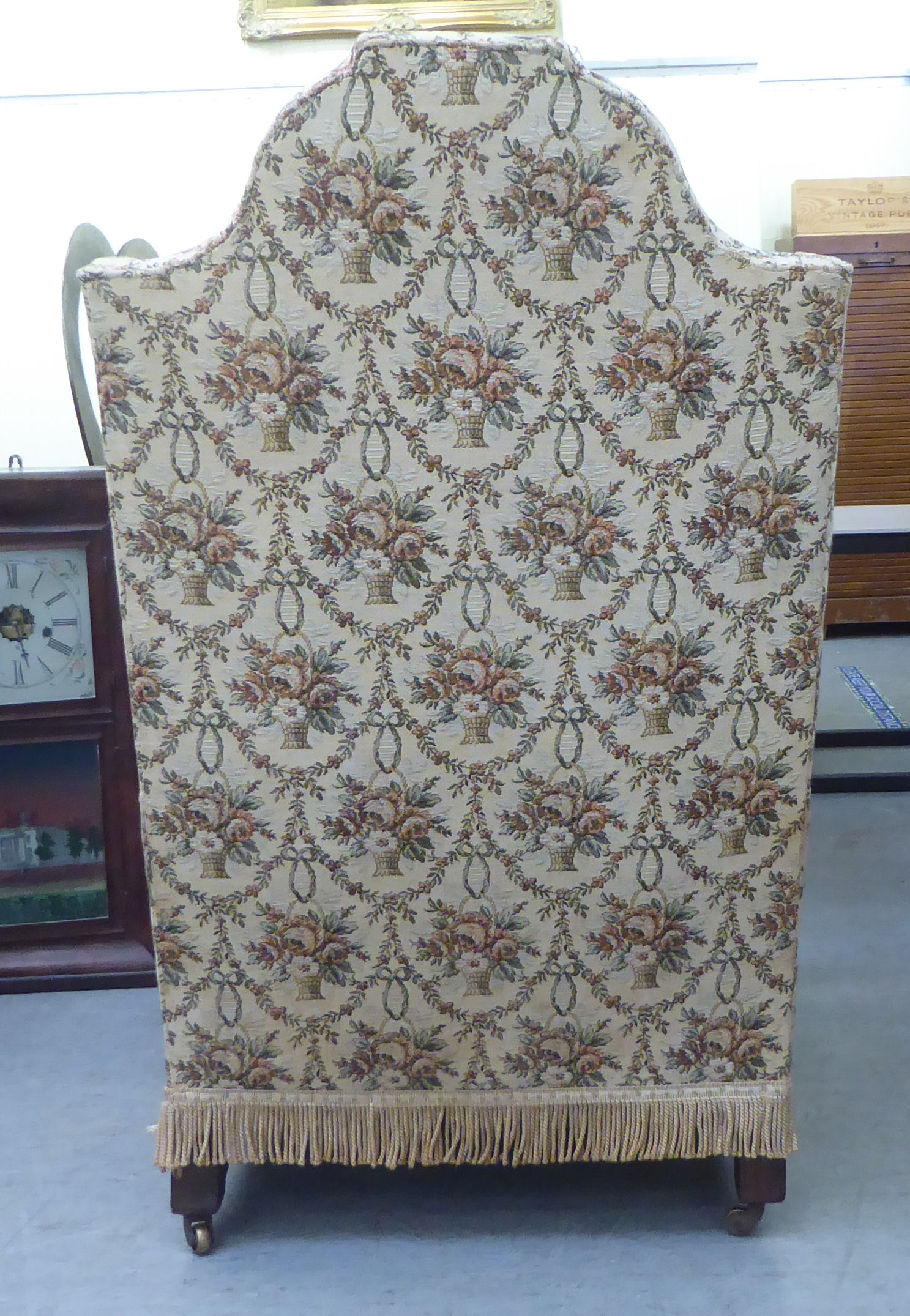 A late 19thC walnut framed tapestry upholstered wingback armchair, raised on paw feet - Bild 3 aus 4