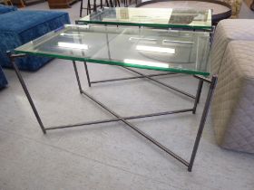 A pair of modern tubular iron framed coffee tables with plate glass tops  22"h  33"w