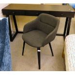 A modern matt black finished three drawer dressing table, raised on trestle ends  30"h  53"w; and