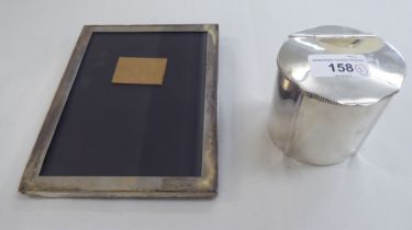 A Sterling silver tea caddy; and a silver photograph frame  stamped Sterling