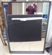 A modern mirror, in a dark wood slip frame  60" x 43"