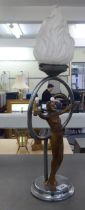 A 1930s gilded spelter and chrome finished figural lamp with a glass flame design shade  24"h