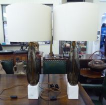 A pair of modern smoked glass and marble table lamps  22"h with cream coloured shades