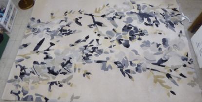 A Villa Nova rug, decorated in tones of blue and grey  ??" x ??"