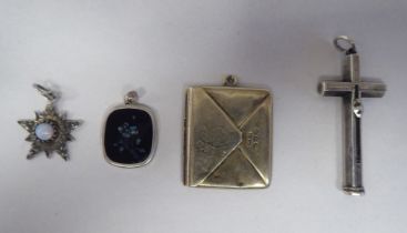 Antique silver pendants, viz. a retractable toothpick; a cross; an envelope; and an inlaid tablet