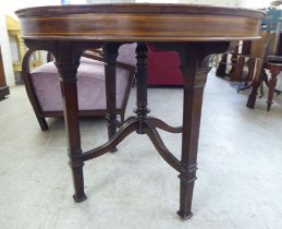 An Edwardian satinwood inlaid mahogany centre table, raised on square legs  30"h  35"dia