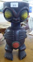 A carved wooden tribal figure  14"h