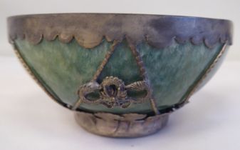 A 20thC Chinese green jadeite bowl, set in a white metal frame  4.25"dia