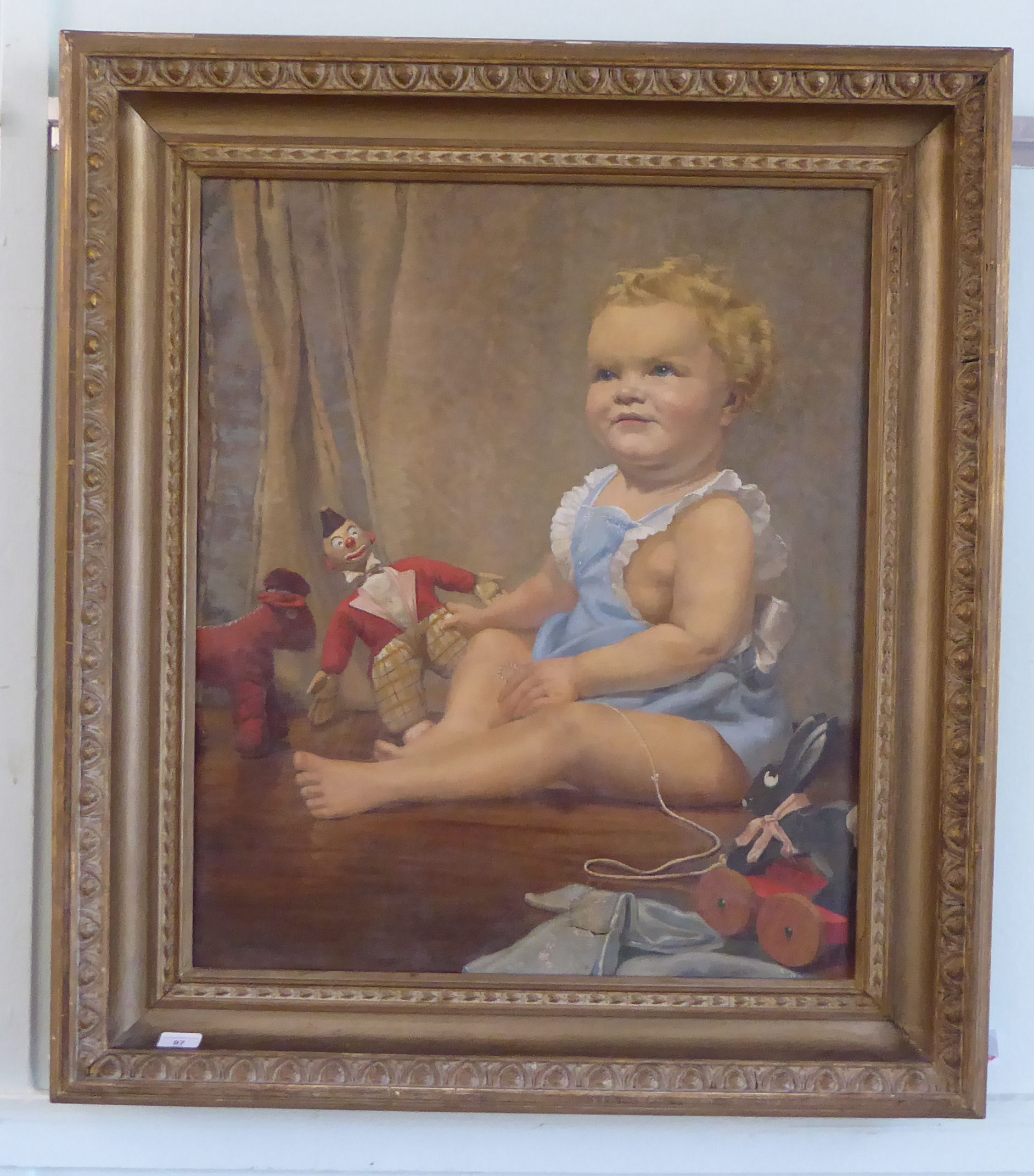 Marjorie Rodgers - a study of a young child playing with toys  oil on canvas  bears a signature