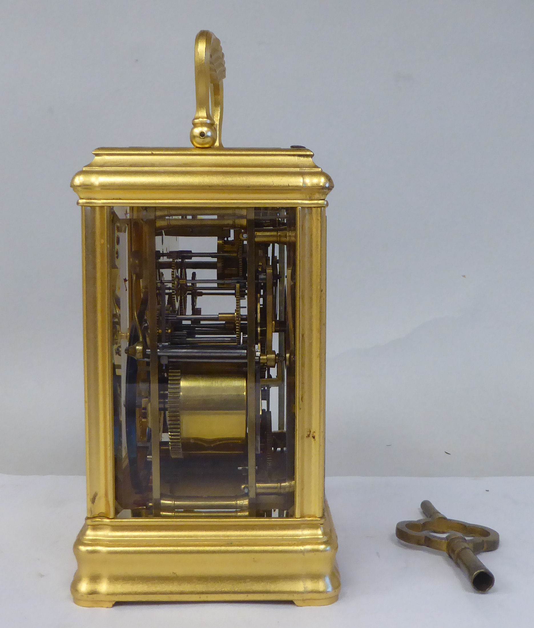 An early 20thC French lacquered brass cased carriage clock with a folding top handle and bevelled - Image 3 of 8