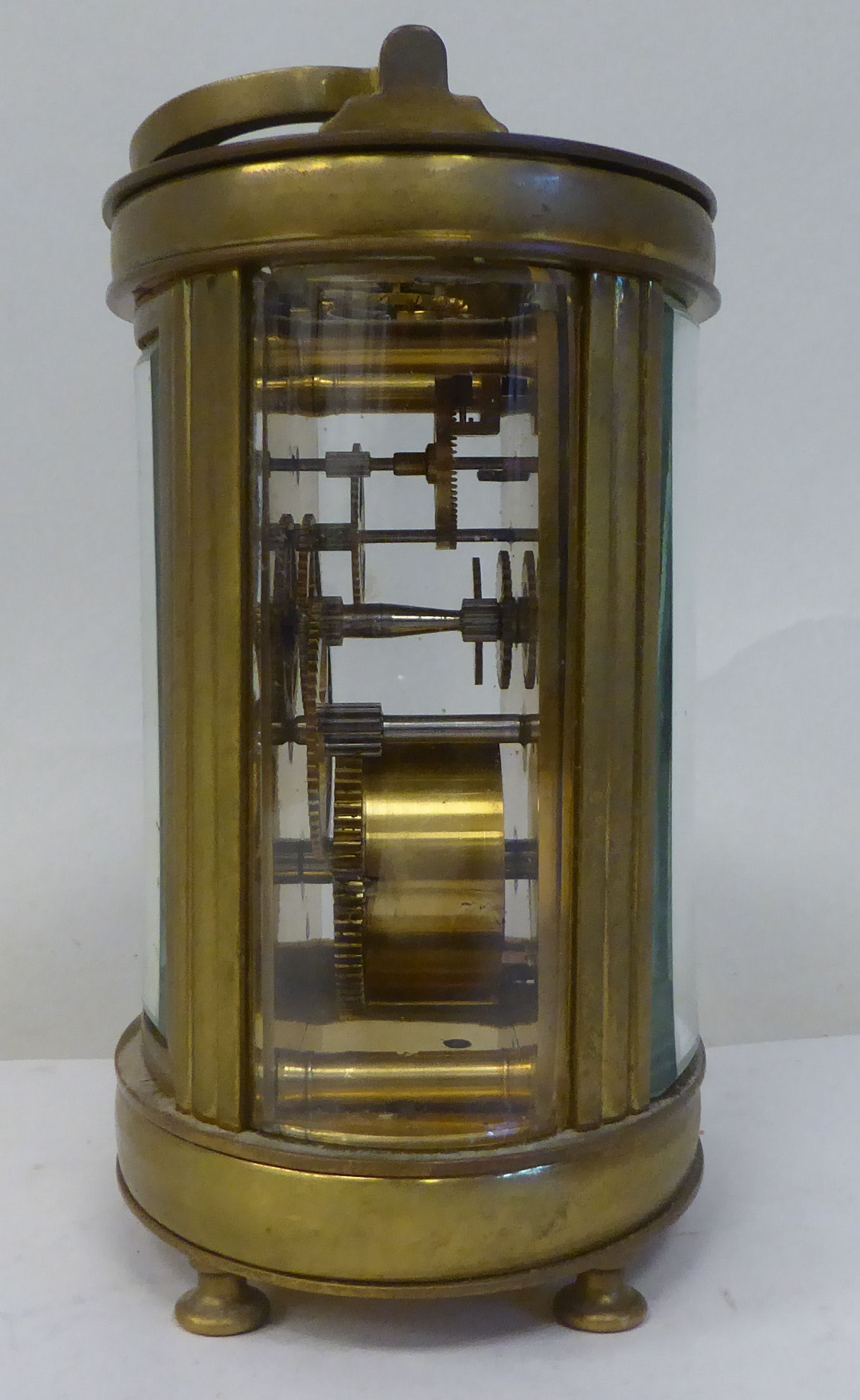 An early 20thC French oval brass cased carriage timepiece with bevelled glass panels and a folding - Image 8 of 11