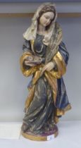 A 19thC carved and painted wooden figure 'St Lucy Patron Saint of Sight and Sufferers of Eye