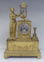 A late 19thC Continental gilded metal cased mantel clock, ornamented with a standing classical