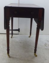 A mid Victorian mahogany Pembroke table, raised on turned, tapered legs  29"h  29"w