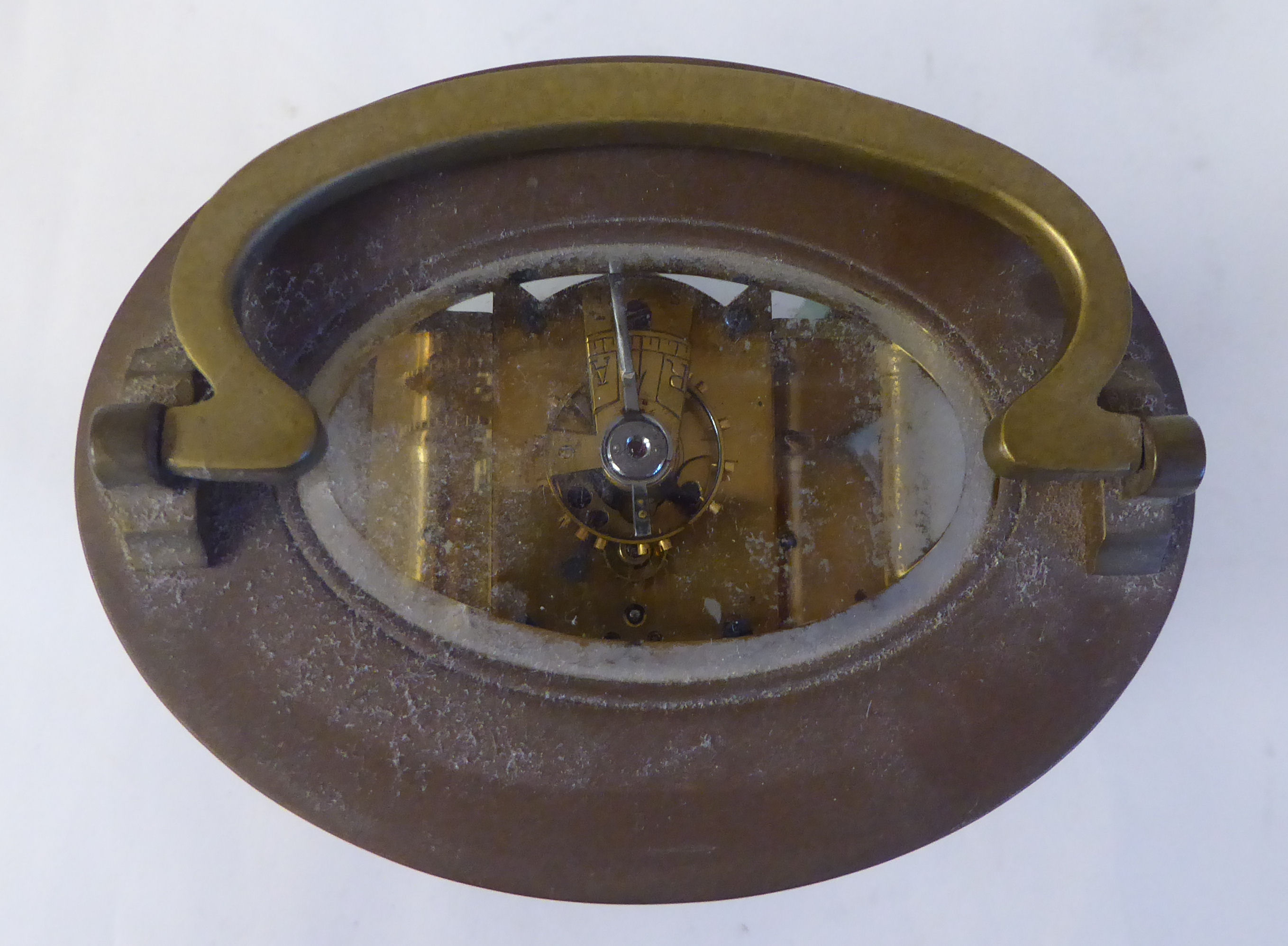 An early 20thC French oval brass cased carriage timepiece with bevelled glass panels and a folding - Image 10 of 11