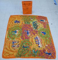 A Hermes silk and wool scarf, designed by Annie Faivre  50"sq in a Hermes bag