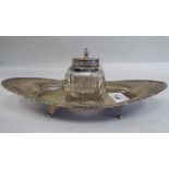 A silver inkstand of boat design with a cut glass reservoir and hinged cap  James Deakin & Sons