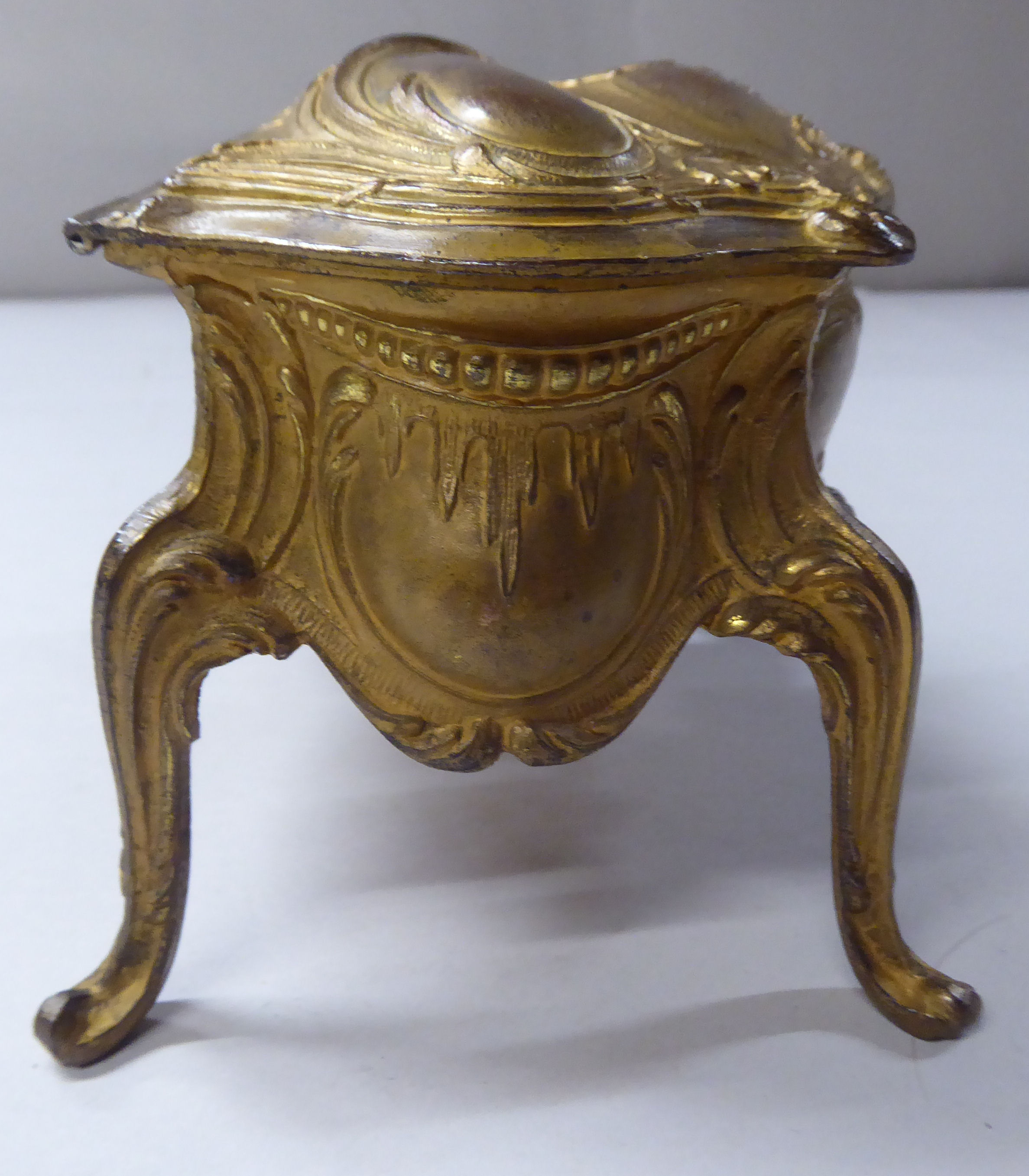 A late 19thC cast gilded metal jewellery box, fashioned as a commode, the hinged lid enclosing a - Image 4 of 10