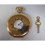 A 9ct gold cased half-hunter pocket watch, the movement faced by a white enamel Roman dial,