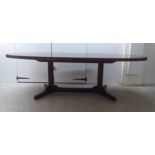 Attributed to Robert Heritage for Archie Shine, a 1960s rosewood extending dining table,