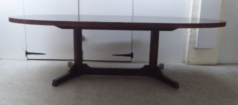 Attributed to Robert Heritage for Archie Shine, a 1960s rosewood extending dining table,