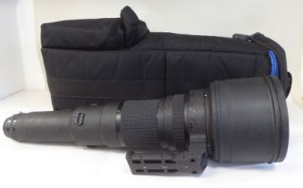 A Nikon Nikkor 800mm 1:5.6 photographic lens, in a padded bag