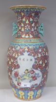 A late 19th/early 20thC Chinese porcelain baluster shape vase with a narrow neck and flared rim,