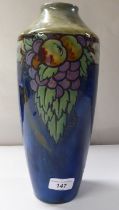 An early 20thC Royal Doulton stoneware vase of shouldered, tapered form, decorated with soft fruit