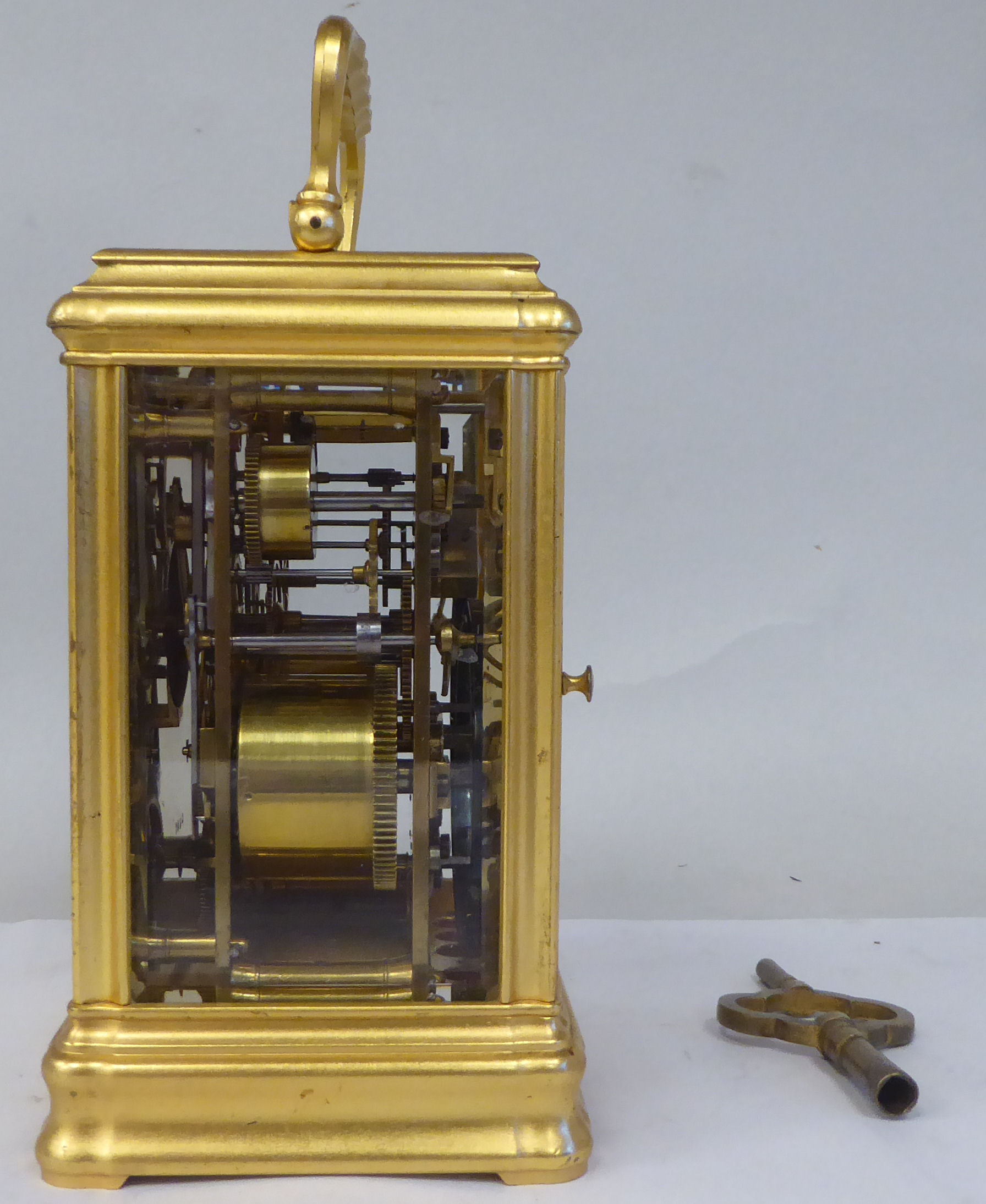 An early 20thC French lacquered brass cased carriage clock with a folding top handle and bevelled - Image 6 of 8