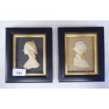 A pair of 19thC carved wax head and shoulders profile portraits, a bewhiskered man and a young