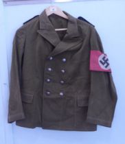 A German NSDAP double breasted 'political' tunic with buttons and epaulettes and a swastika