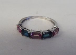 A 9ct white gold ring, set with alternating pink and green tourmalines