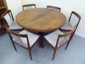 A 1960s Danish Heltborg Mobler rosewood dining table with a two-part top, raised on an angled