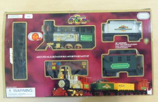 A Rocky Mountain battery operated train set, comprising a locomotive and tender, two carriages and