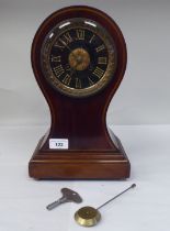 A late Victorian/Edwardian string inlaid mahogany balloon cased mantel clock; the gong strike