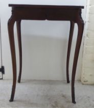 An Edwardian brass inlaid mahogany display table with a glazed hinged lip, raised on cabriole